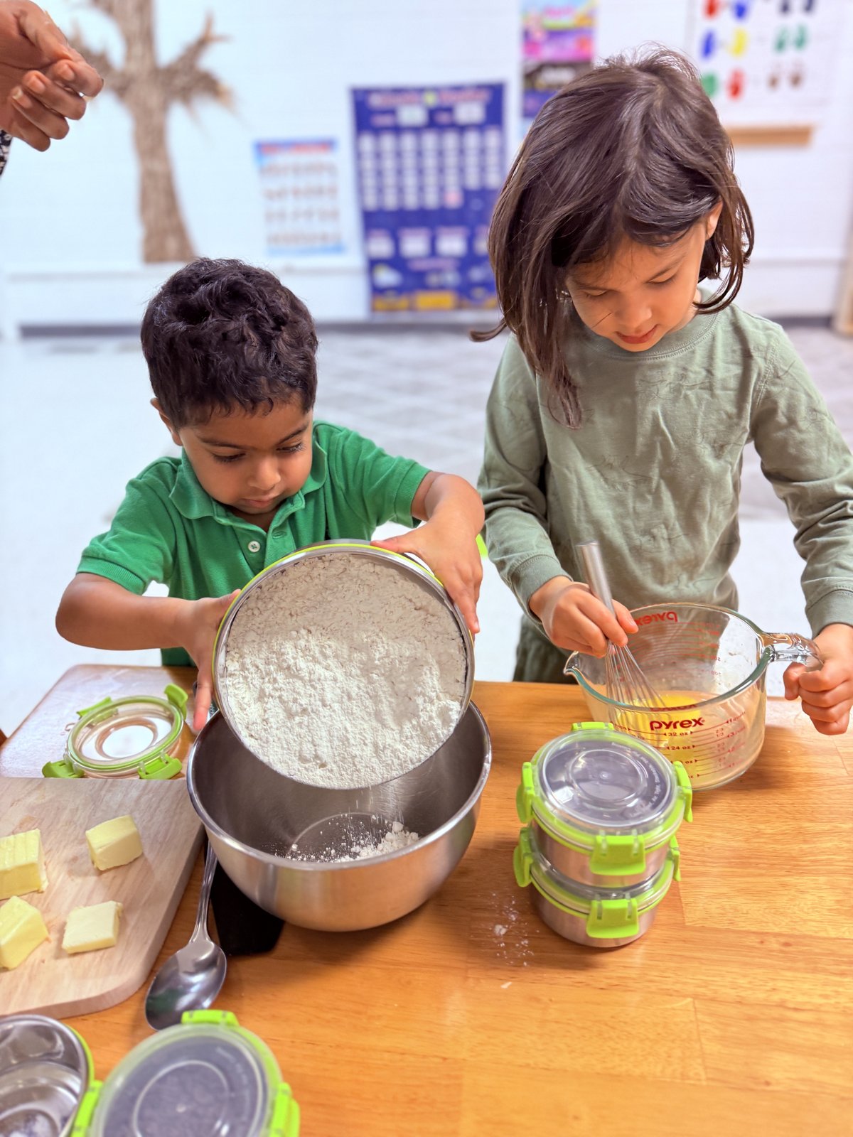 Two children baking and cooking together